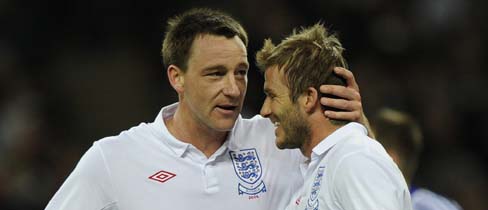 John Terry and David Beckham celebrate a goal.